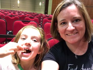 Mom and kid in a convention center ballroom